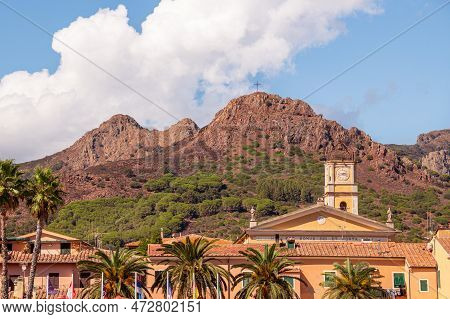 Porto Azzurro Island Of Elba Italy - 19 September 2021 Cityscape Of Harbor Of Porto Azzurro