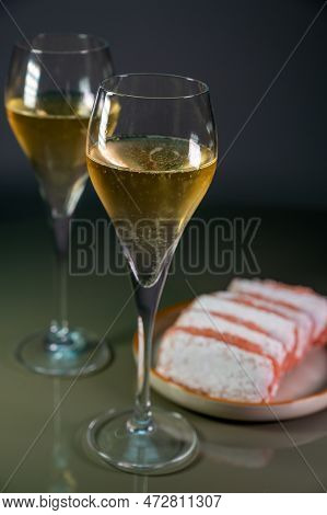 Glasses Of Sparkling White Wine Champagne Or Cava With Bubbles And Sweet Dessert Reims Rose Biscuits