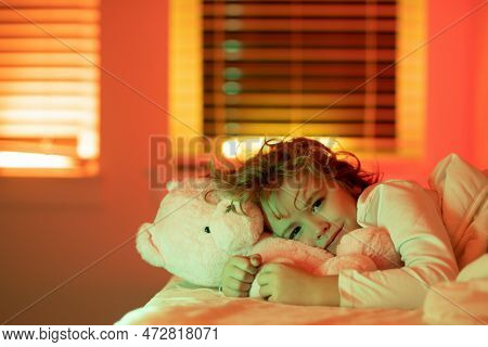 Good Night. Cute Boy Trying To Fall Asleep. Sleepy Child At Naight. Time To Bed. Sleeping Kid. Night