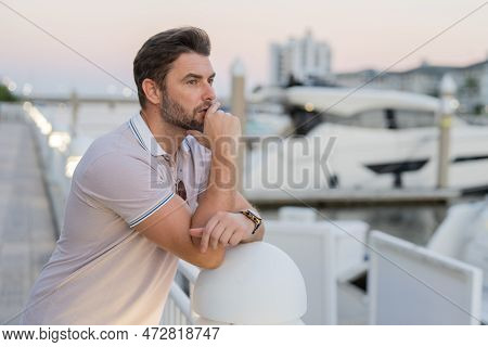 Rich Business Man Dreaming And Thinking Near The Yacht. Handsome Confident Stylish Hipster Model Pos