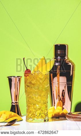 Mango Rum Collins Alcoholic Cocktail Drink With White Rum, Syrup, Ginger Beer, Lemon Juice, Ice And 