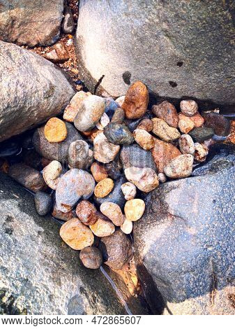 A Pile Of Colorful And Variously Shaped River Stones