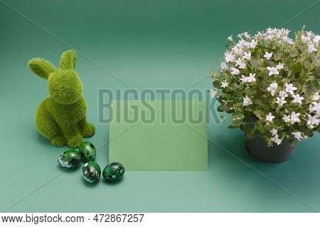 Mockup Easter Green Bunny, Rabbit With Blue Colored Chicken Quail Eggs, Empty Card For Text On Blue 