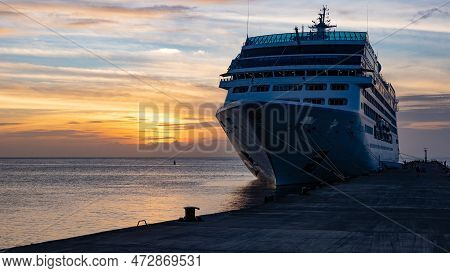 Cruise Ship In Port, Copy Space. Cruise Ship In Port At Sunset. Cruise Ship In Port At Sunrise
