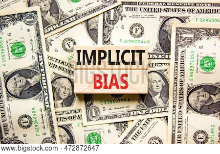 Implicit Bias Symbol. Concept Words Implicit Bias On Wooden Block. Beautiful Background From Dollar 