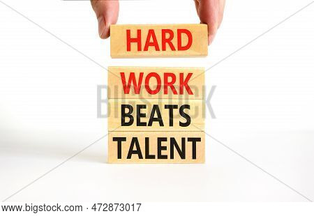 Hard Work Beats Talent Symbol. Concept Words Hard Work Beats Talent On Woodenblock. Beautiful White 