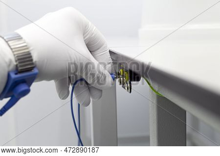 Bracelet On The Hand Of A Man Wearing Esd Cloth And Glove Static Resistance Esd Bracelet Or Ground E