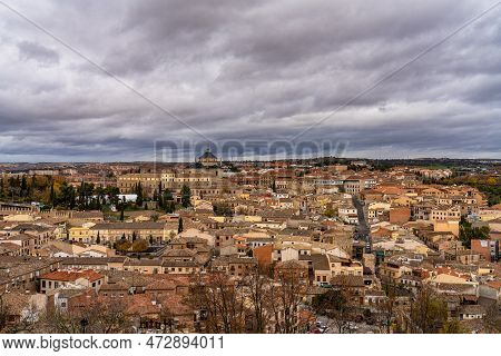 Toledo, Spain - Dec 01, 2022: View Of The Old City From The Alcazar, Royal Palace Over The Tagus Riv