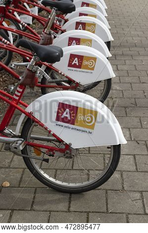 Antwerp, Belgium, 11 March 2023: A Row Of Share Bikes At A Bike Station In Antwerp. Velo Is The Firs