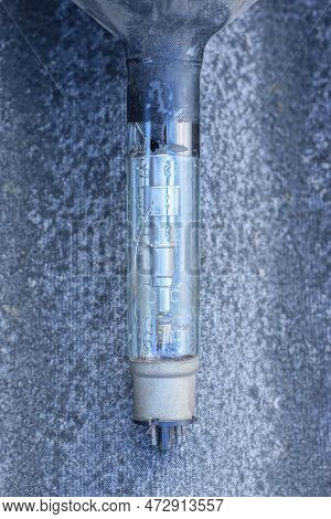 Part One Of A Long Glass Old Lamp On A Kinescope Tube Of A Retro Tv On A Gray Background