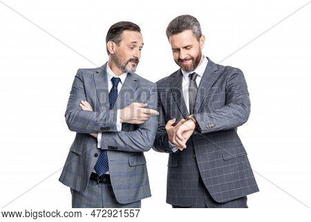 Punctual Businessmen Pointing On Wristwatch. Punctual Businessmen In Studio. Punctual Businessmen