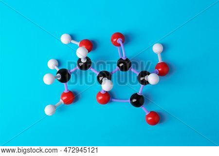 Molecule Of Vitamin C On Light Blue Background, Top View. Chemical Model