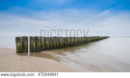 Breakwater On The Beach Of The Baltic Sea Near Rewal. Poland