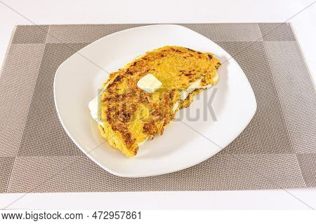 Cachapa Is A Typical Corn-based Dish Stuffed With Fresh Cheese On A White Plate