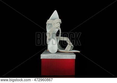 High Heel Shoes  On A Black Background