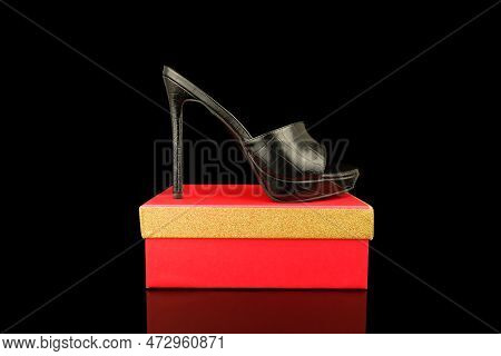 High Heel Shoes  On A Black Background