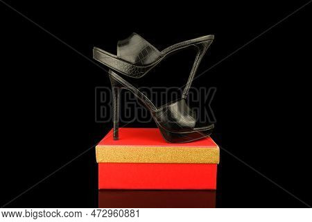 High Heel Shoes  On A Black Background