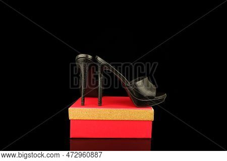 High Heel Shoes  On A Black Background