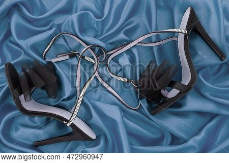 High Heel Shoes  On A Blue Background