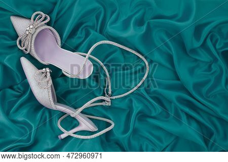 High Heel Shoes  On A Green Background