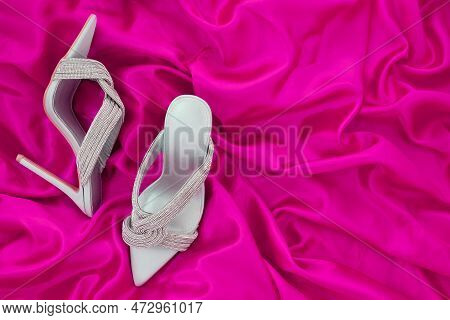 High Heel Shoes  On A Pink  Background