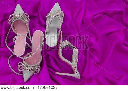 High Heel Shoes  On A Pink  Background