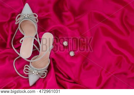 High Heel Shoes  On A Pink  Background