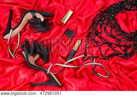 High Heel Shoes  On A Red Background