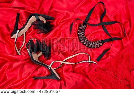 High Heel Shoes  On A Red Background