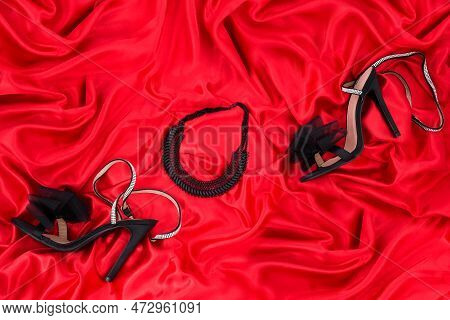 High Heel Shoes  On A Red Background
