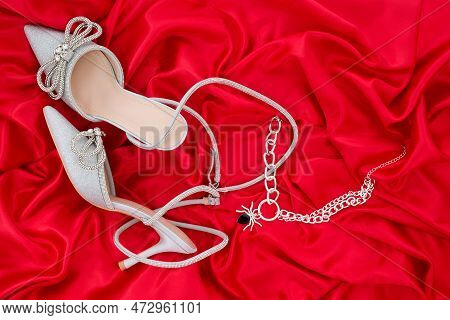 High Heel Shoes  On A Red Background