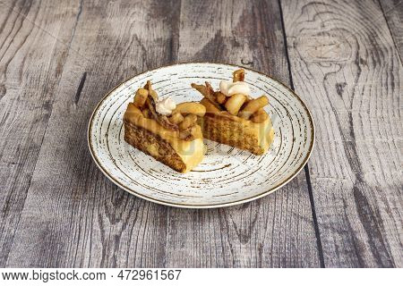Toasted Brioche Bread Stuffed With Squid Rabas In Batter And Fried With A Mayonnaise Medallion On To