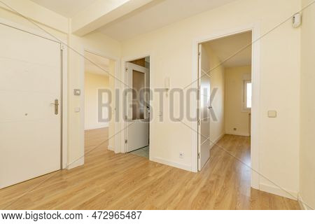 Distributor Of A House With Armored Access Door, And Access To Rooms With White Lacquered Wooden Doo