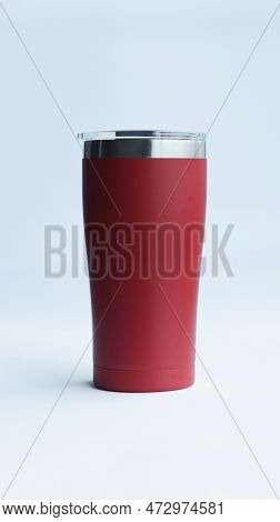 Red Stainless Steel Tumbler And Mug Vacuum Insulated Double Wall Travel Cup With Lid Isolated On Whi