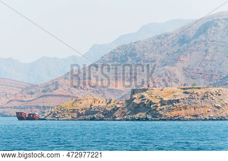 Tour Boats And Tourist On Mirellas Island In Musandam. Oman. Middle East. Famous Travel Destination 