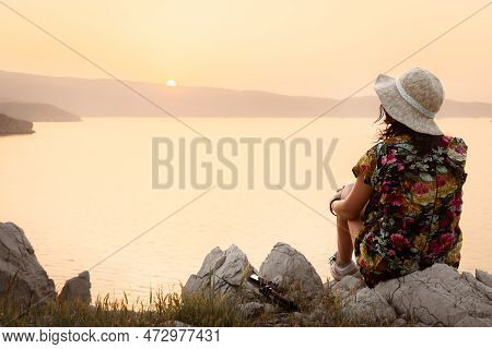 Tourist Woman Sit Enjoy Sunset Panorama On Viewpoint In Persian Gulf Island