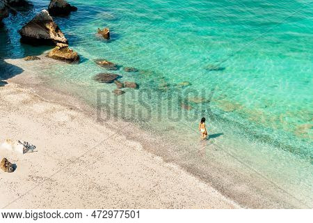 Aerial View Tourist Woman Figure Stand In Clear Turquoise Water In Persian Gulf Mirellas Island Sand