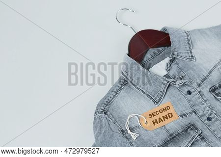 Gray Denim Shirt On Hanger And Tag With Inscription Second Hand On White Background. Second Hand Clo