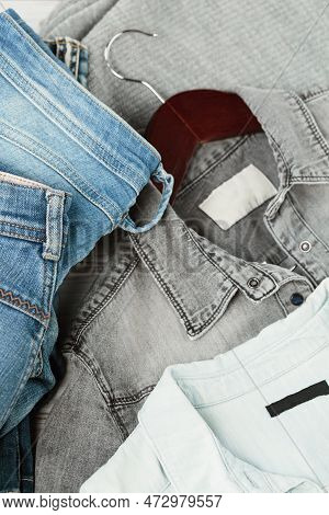Stack Of Blue Jeans, Shirts. Second Hand Clothing Shop. Circular Fashion, Eco Friendly Sustainable S