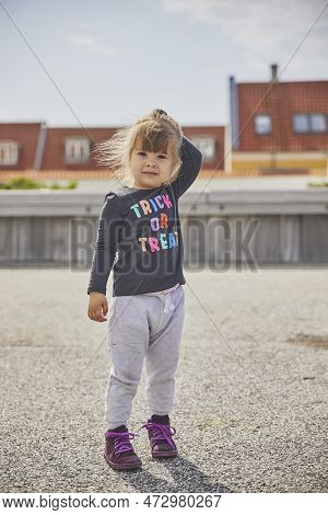 Sad Child Walking In The City In Denmark