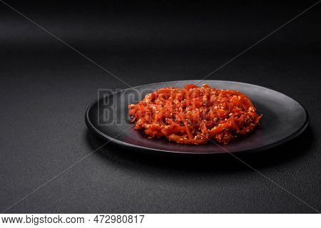 Dried Squid Chopped Into Slices And Seasoned With Sesame Seeds And Spices
