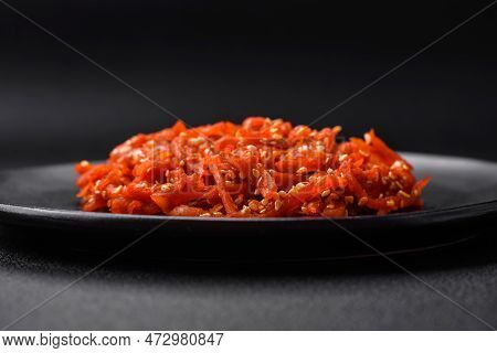 Dried Squid Chopped Into Slices And Seasoned With Sesame Seeds And Spices