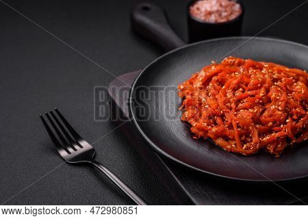 Dried Squid Chopped Into Slices And Seasoned With Sesame Seeds And Spices