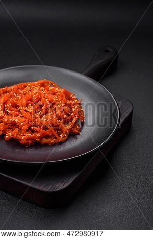 Dried Squid Chopped Into Slices And Seasoned With Sesame Seeds And Spices