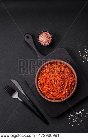 Dried Squid Chopped Into Slices And Seasoned With Sesame Seeds And Spices