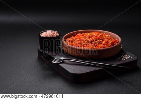 Dried Squid Chopped Into Slices And Seasoned With Sesame Seeds And Spices