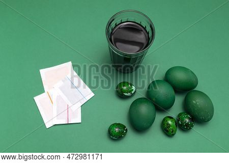 Eggs Painting Dye, Colorant In Paper Bag, Package. Glass With Colored Water, Green Easter Hen, Quail