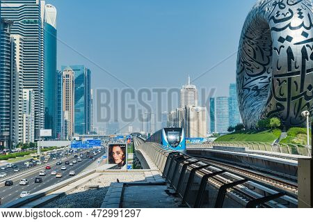 Dubai, Uae - October 2022: Dubai Metro Train Railway Along With Museum Of Future. Dubai Metro Is A R