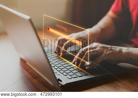 Adult Man Using A Laptop Computer For Download Software And Waiting To Loading Digital Business Data