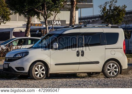 Side, Turkey -february 13, 2023:  White Fiat Doblo   Is Parked  On The Street On A Warm Summer Day A